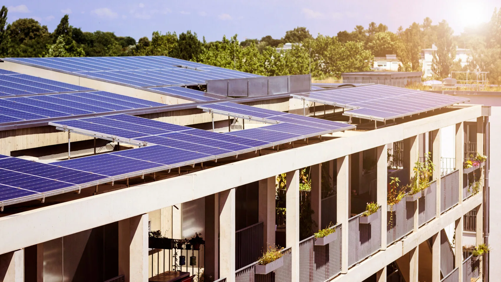 Solar panels on the roof of a residential apartment building.